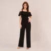Adrianna Papell Jersey Banded Ruffled Jumpsuit With Cold Shoulder In Black