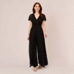 Adrianna Papell Jersey Jumpsuit With Chiffon Capelet And Skirt Overlay In Black